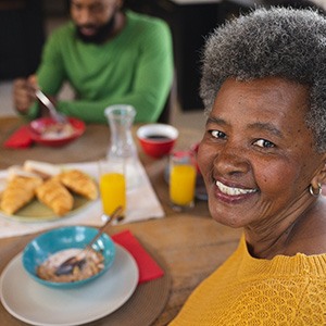 A woman eating with dentures